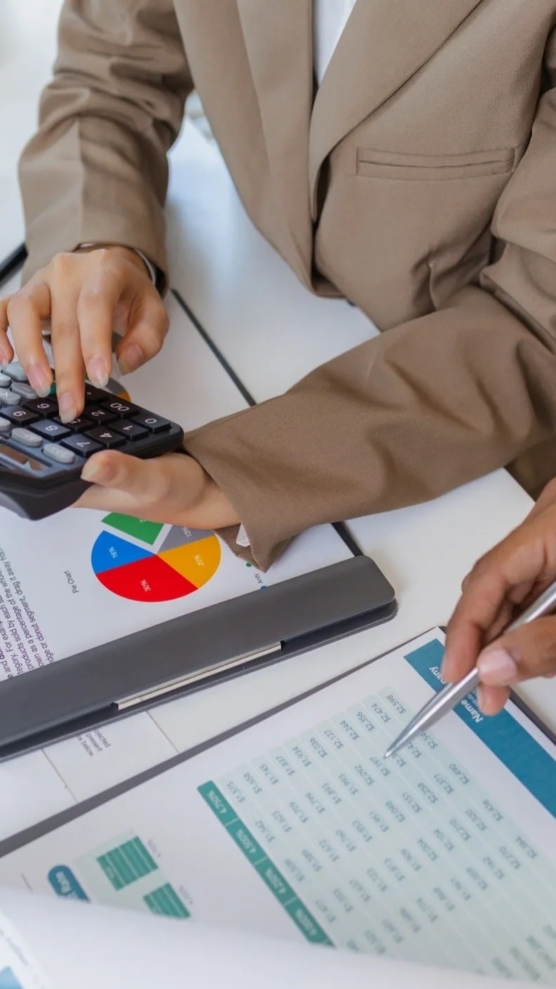 Business leaders reviewing financial reports together